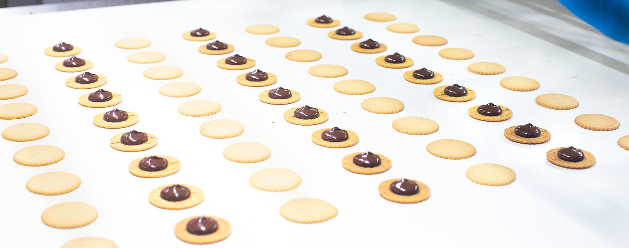 Three Dewey's employees manufacturing cookies